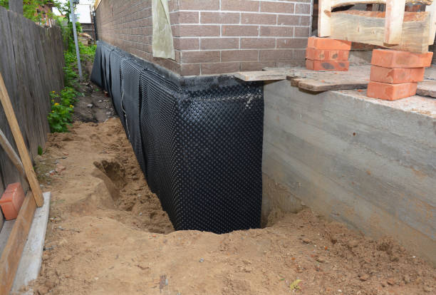 SJ Waterproofing Pros technician performing targeted Waterproofing assessment in Hillsboro, WI